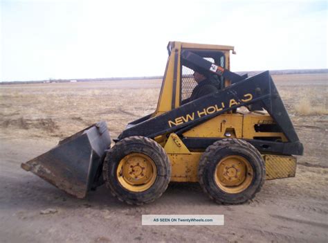 new holland skid steer with auger|new holland l553 skid steer.